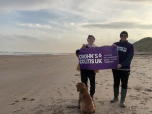 on the beach with banner